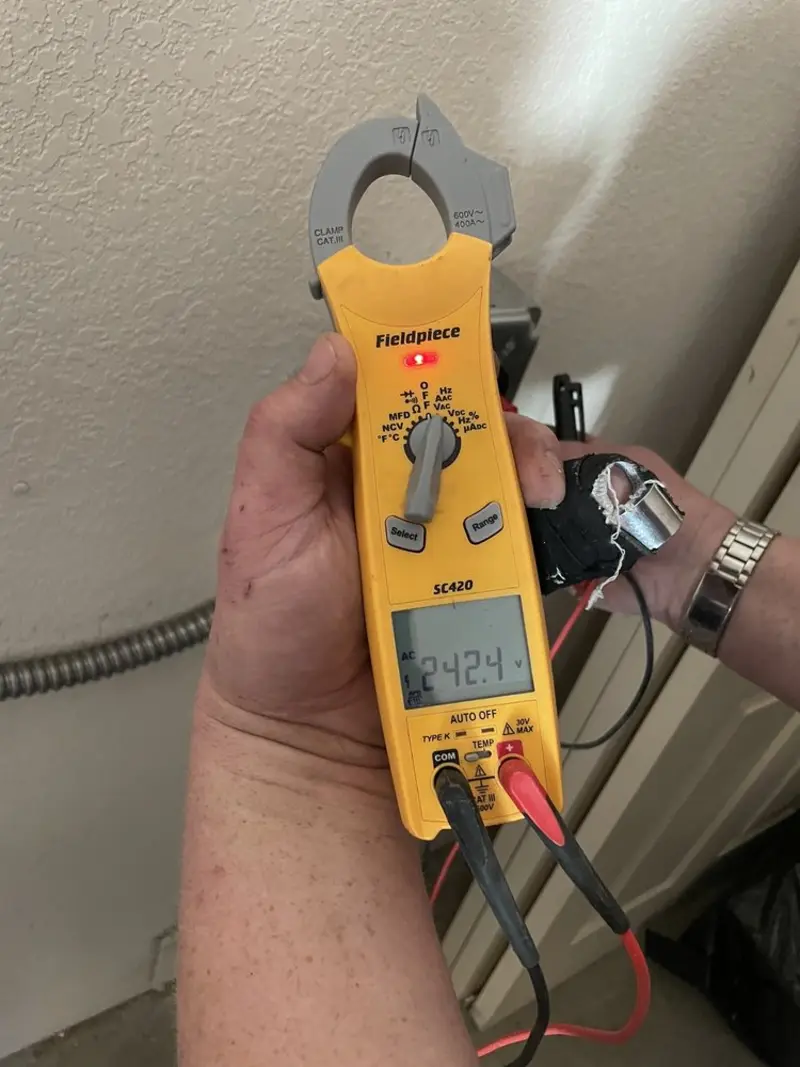 Voltage testing with clamp meter during Electrical Installation Services in Florida City